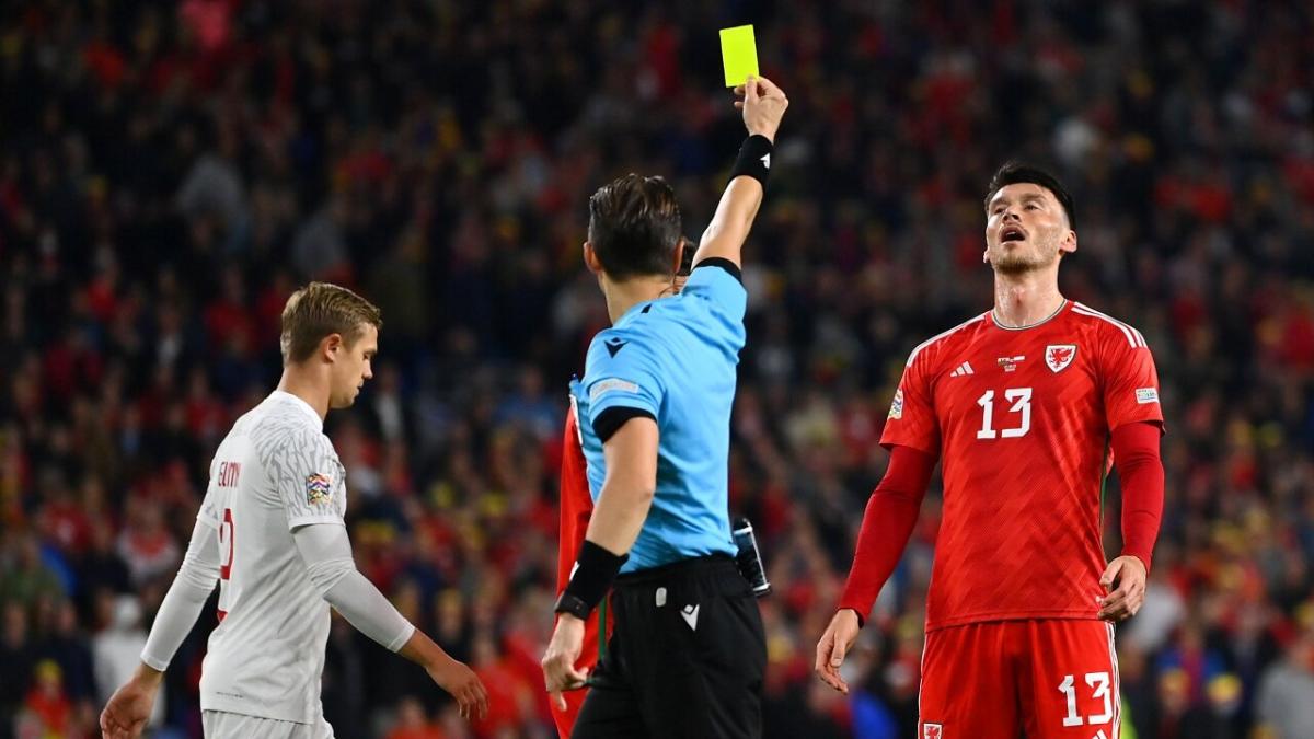Wales forward Kieffer Moore is booked